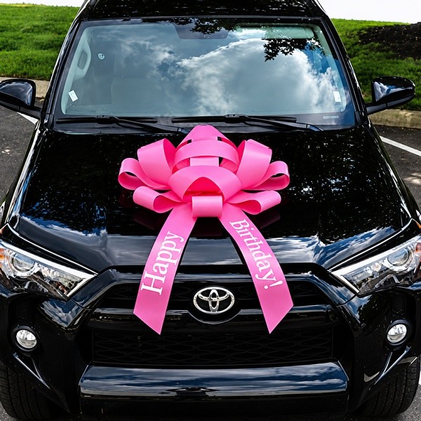 30-inch pink magnetic car bow with Happy Birthday lettering