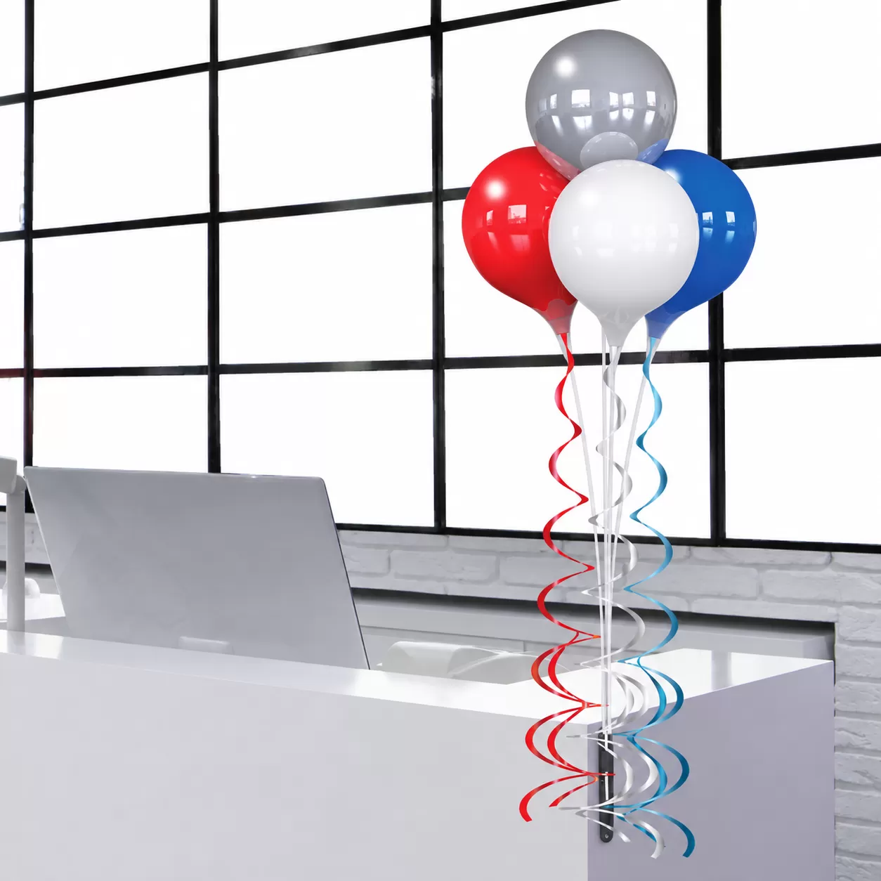 Four PermaShine balloons in silver, red, blue and white on a vertical bracket