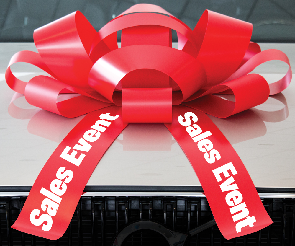 30-inch red and white magnetic car bow with Sales Event lettering