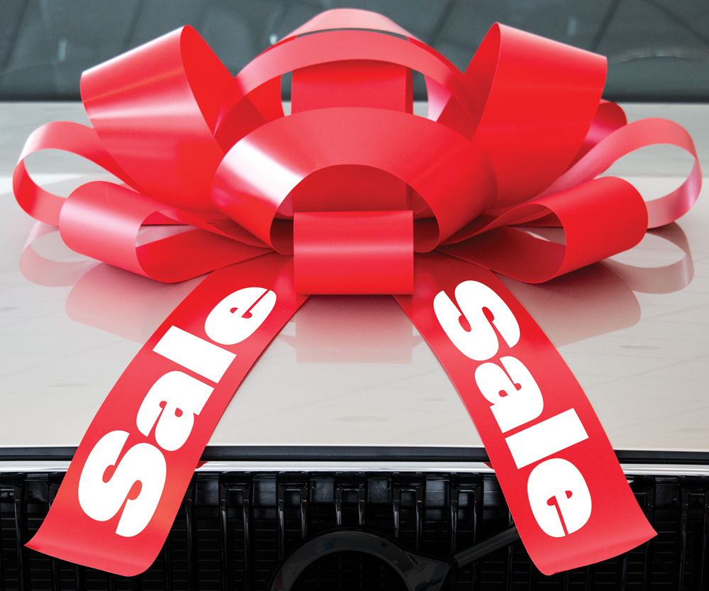 30-inch red and white magnetic car bow with Sale lettering