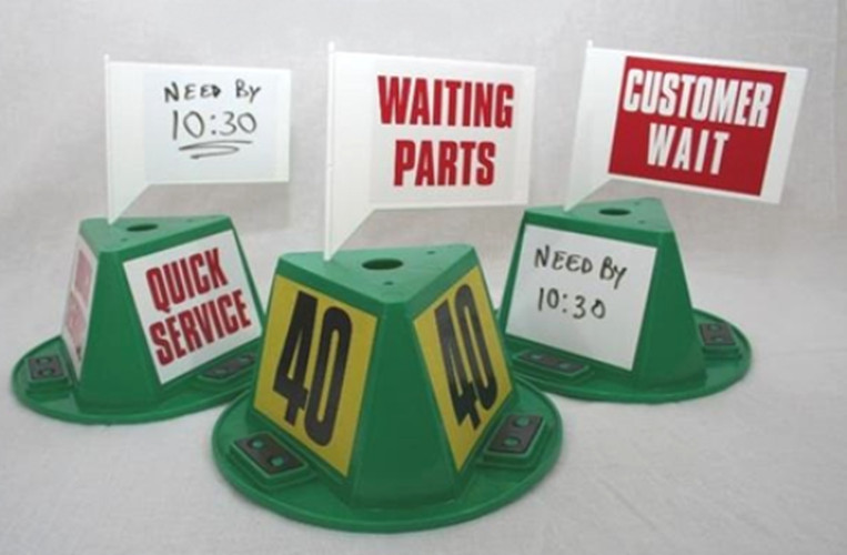 White message flags fitted to green car top hats with dry erase, WAITING PARTS and CUSTOMER WAIT decals