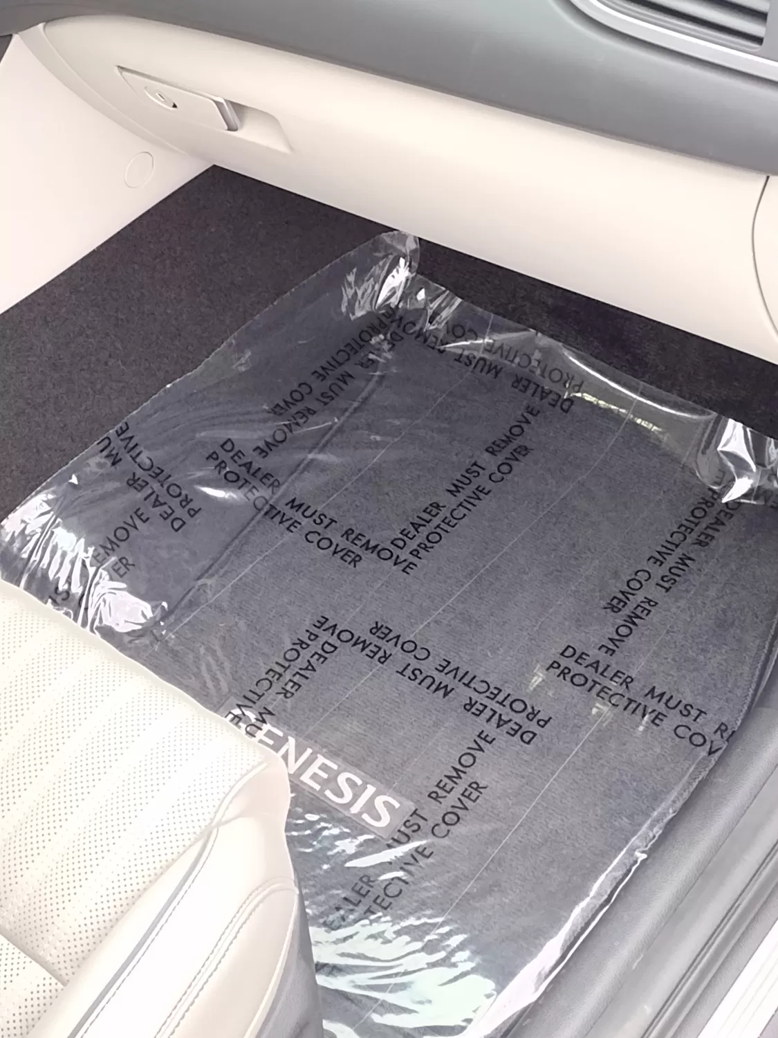Clear 4 mil adhesive floor mat protecting vehicle carpet, printed Dealer Must Remove Protective Cover
