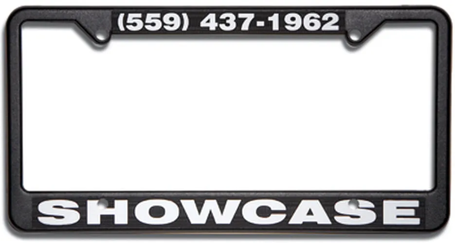Black custom raised-letter license plate frame with white SHOWCASE lettering and phone number