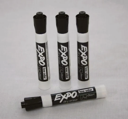 Four black dry erase markers for writing on dry erase decals and boards